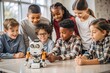 © hobonski - Young Students Engage in Robotics Learning. A group of enthusiastic children, ranging from diverse ethnic backgrounds, gather around a table in a classroom setting.