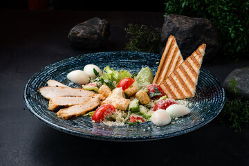 Wall Mural - Italian kitchen Caesar salad with chicken, parmesan cheese, eggs, lettuce, tomatoes, croutons and fried toast.