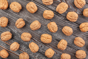 Wall Mural - walnuts on wood background top view