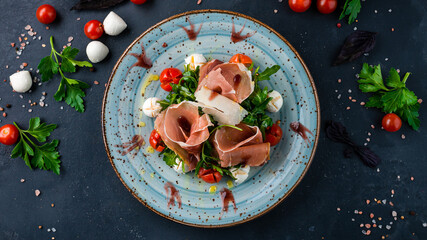 Canvas Print - Green salad with cherry tomatoes, mozzarella cheese, arugula, bacon and parmesan.