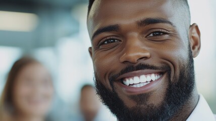 A man with a beard and a smile on his face