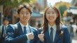 © shiro - 笑顔でガッツポーズする日本人高校生の男女