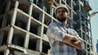 © Julia - Man, arms crossed and portrait with architect on construction site, building development and engineering confidence. Contractor, architecture employee and helmet safety, urban project and serious