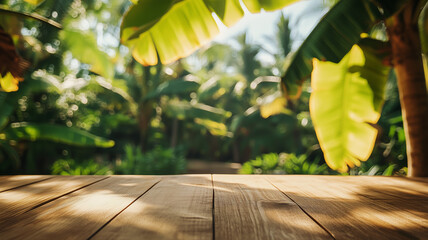 Wall Mural - A wooden table with a banana tree in the background, slightly blurred, with soft sunlight filtering through the large leaves, emphasizing the tropical vibe.