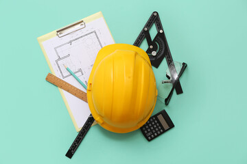 Poster - Architect's supplies with hardhat and house plan on green background