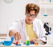 © Elnur - Funny crazy chemist doing experiments and tests