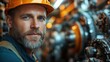 © Tomass - Bearded male marine engineer inspecting machinery in ship's engine room with focused expression