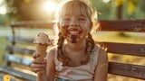 Delightful Mess: The little girl on the park bench, with chocolate-sticky hands and face, giggles with pure happiness as she enjoys her ice cream treat.