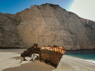 Wall Mural - Navagio Beach shipwreck with towering cliffs in Zakynthos, Greece