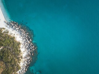 Wall Mural - View of a beautiful beach with clear turquoise waters and rocky coastline on Zakynthos Island