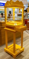 Poster - Yellow Wooden Display Stand with Glass Shelves and Drawer in a Jewelry Store