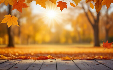 wooden table, orange falling leaves and autumn park on blurred background