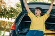 © carballo - young man in the trunk of the car happy on trip