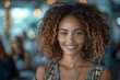 © btiger - Young Woman With Curly Hair Smiling Indoors Warm Lighting Bokeh Background