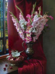 Wall Mural - Still life with bouquet of gladiolus flowers and raspberry