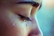 © Елена Григорова - Emotional moment captured as a tear falls from an eye.