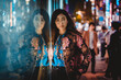 © oneinchpunch - Beautiful young asian woman wearing fashionable attire portrait with blurred city lights - Stylish teen female with cool style