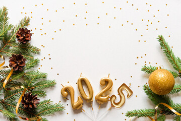 Wall Mural - christmas card banner with christmas tree branches and gold candle numbers 2025, cones and golden de