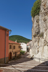 Sticker - A street between old houses in Pietrabbondante, a village in Molise in Italy.