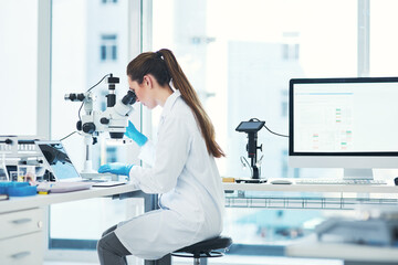 Woman, research and microscope at lab for bacteria with medical study, investigation and development. Female scientist, lab coat and science with testing for virus, disease and illness with computer