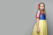 © millaf - Attractive child girl theater actress on white background with copy space