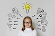 © millaf - Creative child girl with light bulb and question marks on white background. Education and idea concept