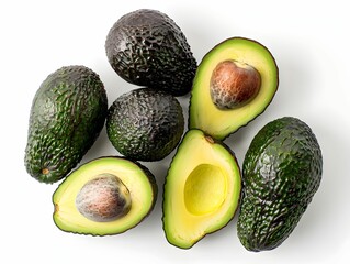 Wall Mural - Fresh avocados arranged on a white background showcasing whole and halved fruits with vibrant green flesh