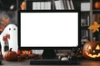 © Tapanut - Halloween-themed workspace with a blank computer screen, decorated with pumpkins, ghost, and autumn leaves in an office setting.
