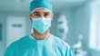 © JAYDA RIN - A confident male surgeon in a sterile environment, wearing a surgical mask and cap, prepared for a medical procedure.
