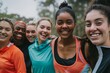 © neirfy - A group of friends in colorful activewear enjoys outdoor fitness activities, sharing positivity and fun together