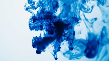 Leinwandbilder - Blue ink dropping into clear water, creating swirling patterns and abstract shapes