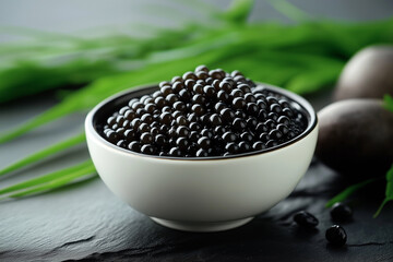 black caviar in a plate on the table