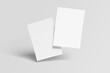 © azanul - White blank sheets of a4 paper size or documents mockup on a gray background. Template for design blank paper sheets