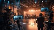 © netrun78 - The atmosphere is lively as camera operators and stage crew finalize their setups while the host prepares for the broadcast.