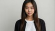 © Alteisen Riese - teen stunning brunette asian woman with black shirt model portrait standing straight on a plain white background for ad concept space for text