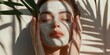 © Jakkarin - A photorealistic image of a woman applying a luxurious face mask, her eyes closed, radiating a sense of calm and rejuvenation.
