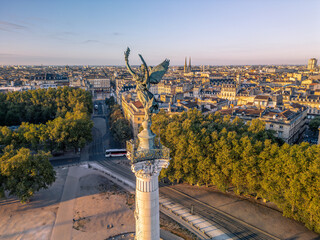 The drone aerial view of The Girondins Monument and Bordeaux city at sunrise. Monument aux Girondins (The Girondins Monument) is a dramatic fountain statue in Bordeaux. 