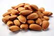 © Agustin - Heap of Raw Almonds with Shells on White Background