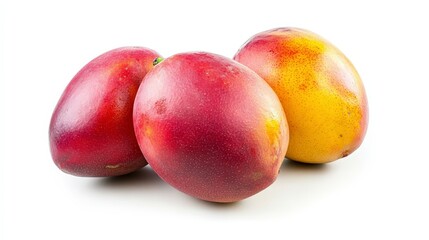 Three ripe mangoes, two red and one yellow, on a white background.