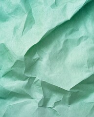 Canvas Print - Crumpled teal paper texture showcasing intricate folds and shadows in bright lighting