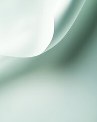 Wall Mural - Delicate fabric draping softly on a light mint green background in a serene composition