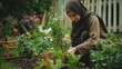 © Erd.Concept - Woman Gardening in Hijab