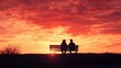 © Ben Kuang - Silhouette of a couple enjoying a romantic sunset on a park bench.