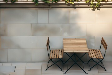 Set of wooden table and two chairs on outdoor stone floor