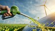 © Elmira - A green fuel nozzle pours droplets of biofuel against a backdrop of wind turbines and solar panels, highlighting a commitment to renewable energy sources