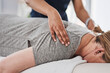 © Frank Coop/peopleimages.com - Massage, hands and physiotherapist with person, back and healing of pain of patient, healthcare and injury. Wellness, chiropractor and help for relief of tension, expert and physiotherapy in clinic
