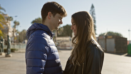 Poster - A man and woman in love, sharing a moment on a sunlit urban street, exuding romance and connection amidst the city life.