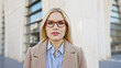 © Krakenimages.com - Stylish young woman in glasses posing outdoors in the city.