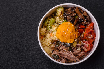 Bowl of food with beef, bulgur, tomatoes, mushrooms, zucchini