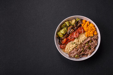 Wall Mural - Bowl of food with beef, bulgur, tomatoes, mushrooms, zucchini